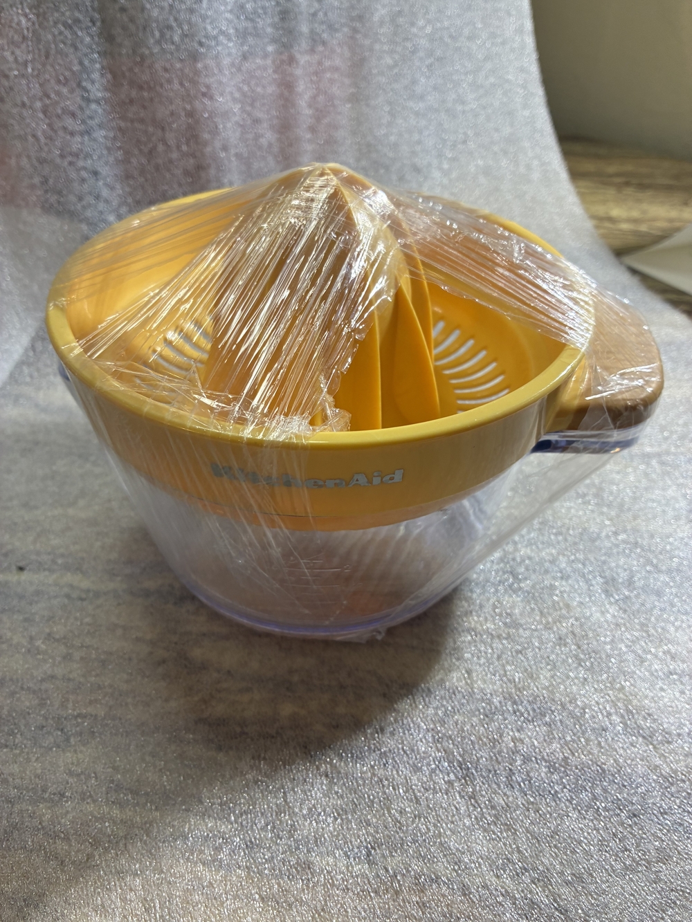 KitchenAid Bright Yellow Hand Citrus Juicer with Clear Bowl